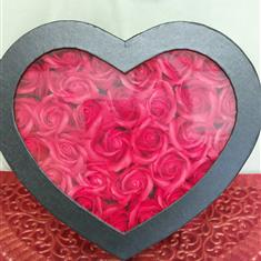 Silk red roses in hat box